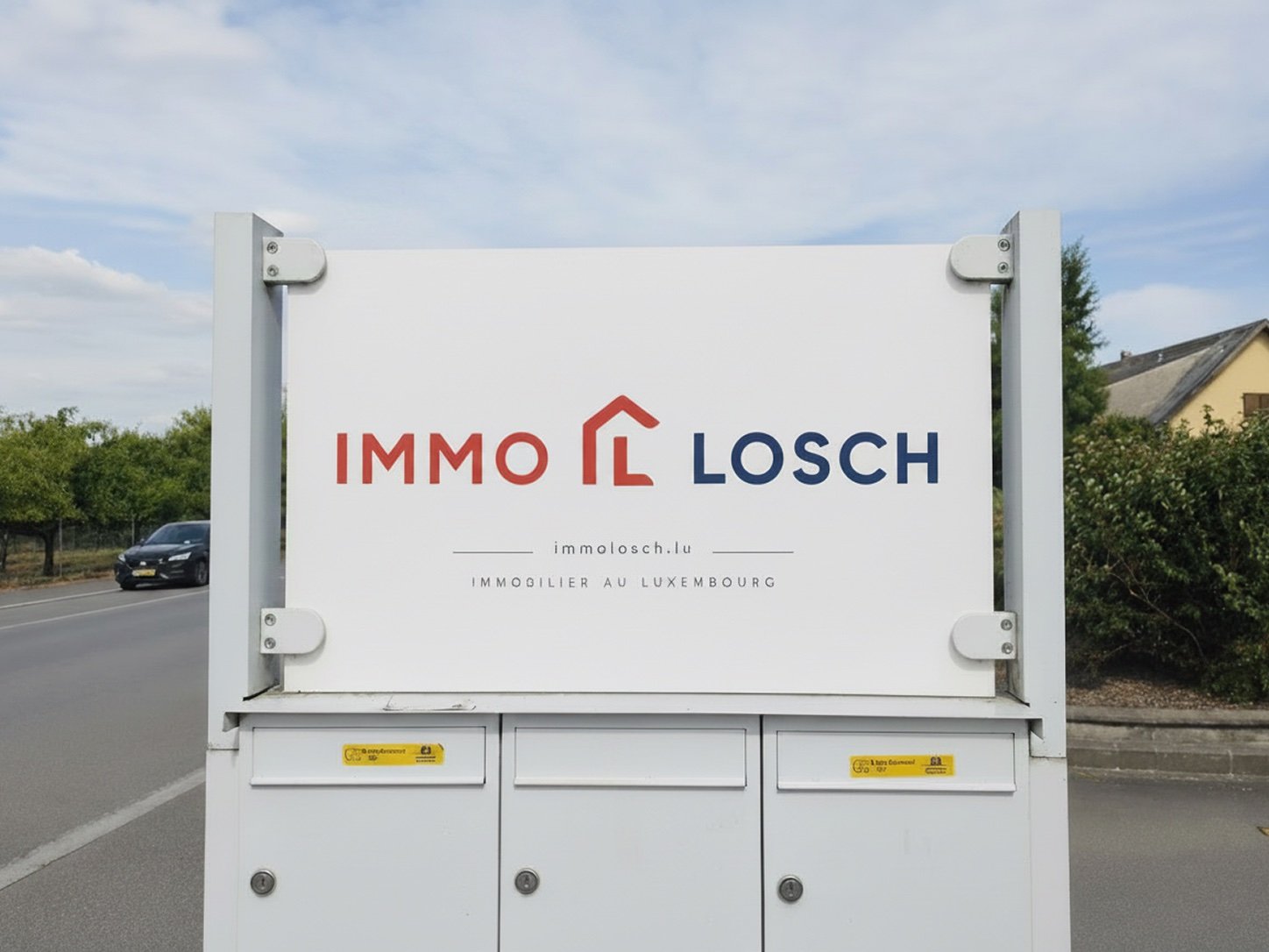 ImmoLosch sign outside our office in Hellange